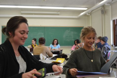 Emilee Herrick and Emily Goonan preparing research in class